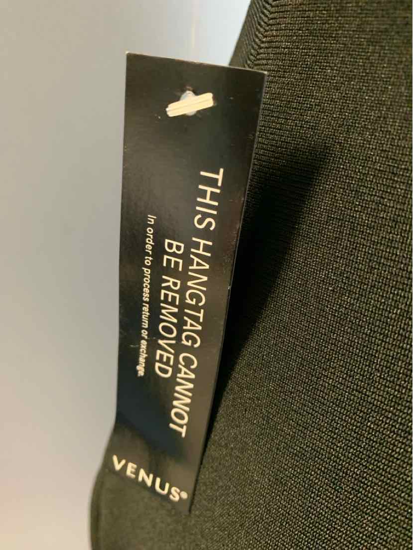 Black fabric with woven texture and a black tag reading "THIS HANGTAG CANNOT BE REMOVED" in gold lettering.