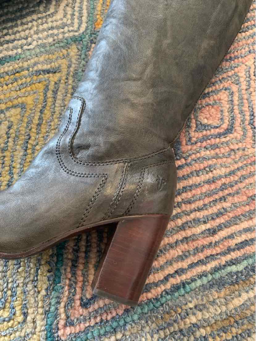 Gray leather mid-calf boot with stacked wooden block heel and decorative stitching.