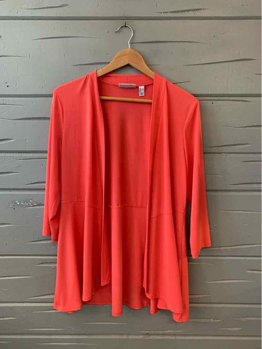 Coral open-front cardigan with three-quarter sleeves and a flowy drape design.