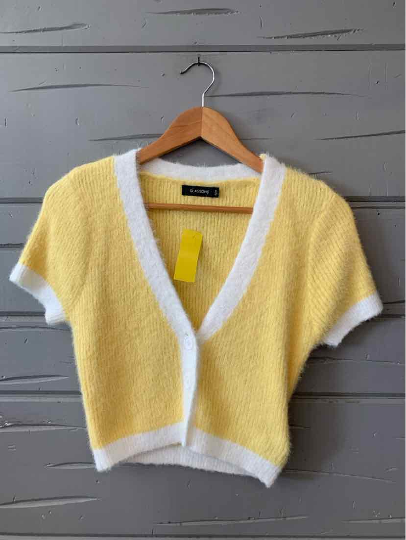 Yellow short-sleeve cardigan with white trim, deep V-neck, and soft textured fabric.