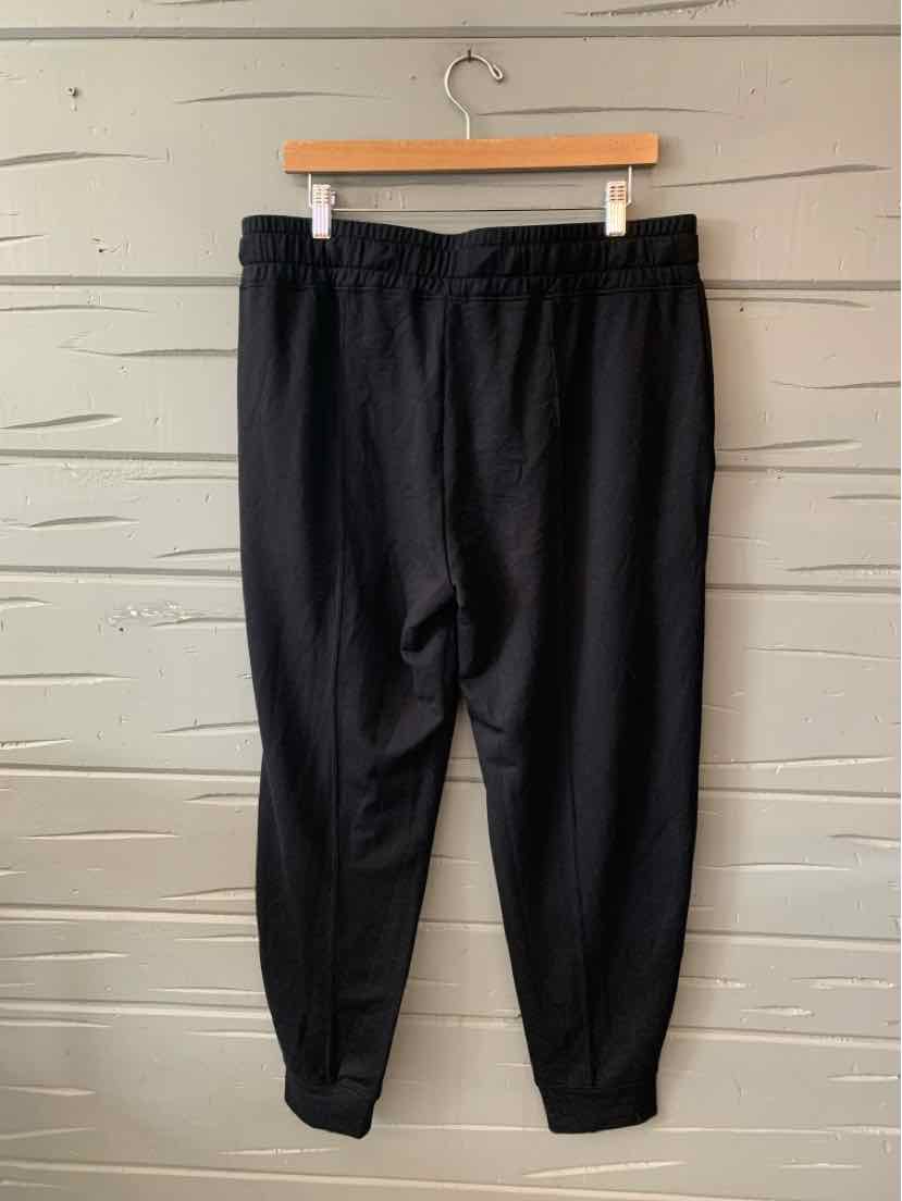 Black tapered jogger pants with elastic waistband and cuffs, size XL.