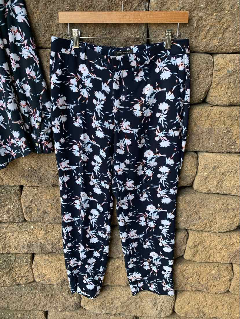 Navy floral print pants with white and pink blossoms, tapered fit, size S/M.