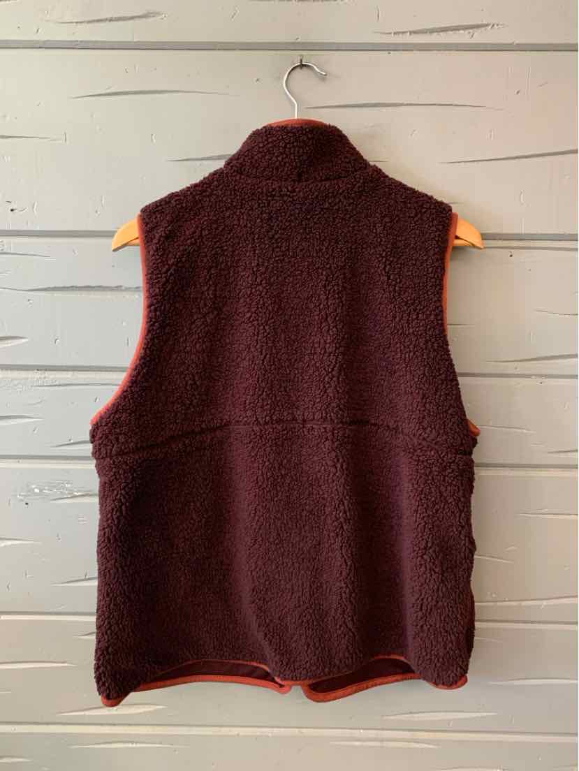Women’s burgundy sleeveless fleece vest with a high collar, shown from the back.