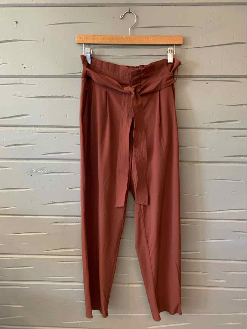 High-waisted burgundy pants with a tied waist belt and tailored front pleats in size 6.