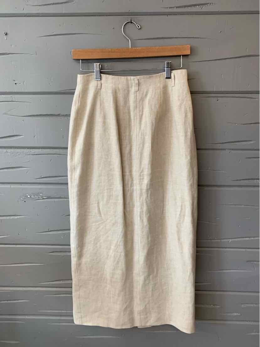 Beige linen straight midi skirt with front slit and waistband in size 6 hanging on wooden hanger.