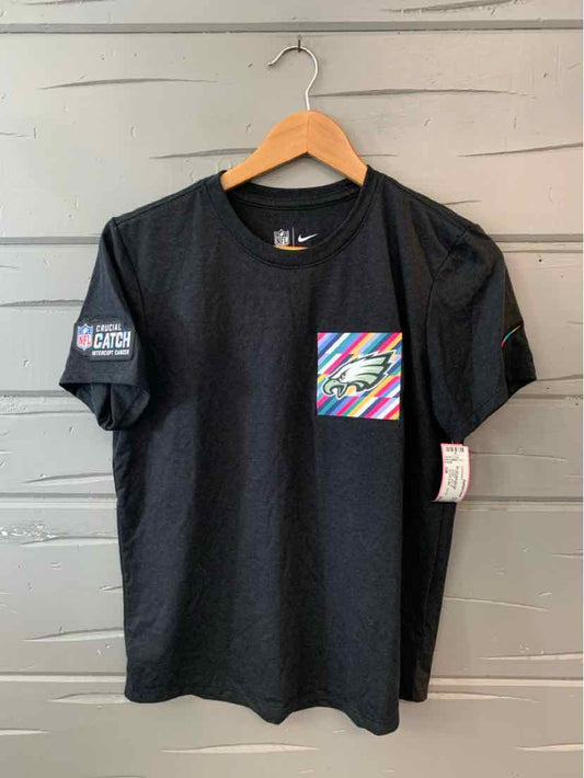 Black NFL t-shirt with colorful diagonal stripes pocket and NFL logo patch on sleeve, size small.