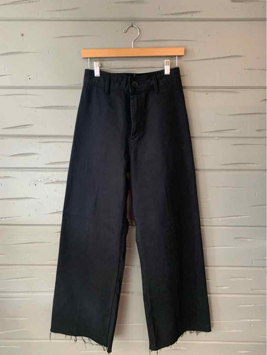 Black Zara wide-leg trousers with a flat front, belt loops, and full-length hems.