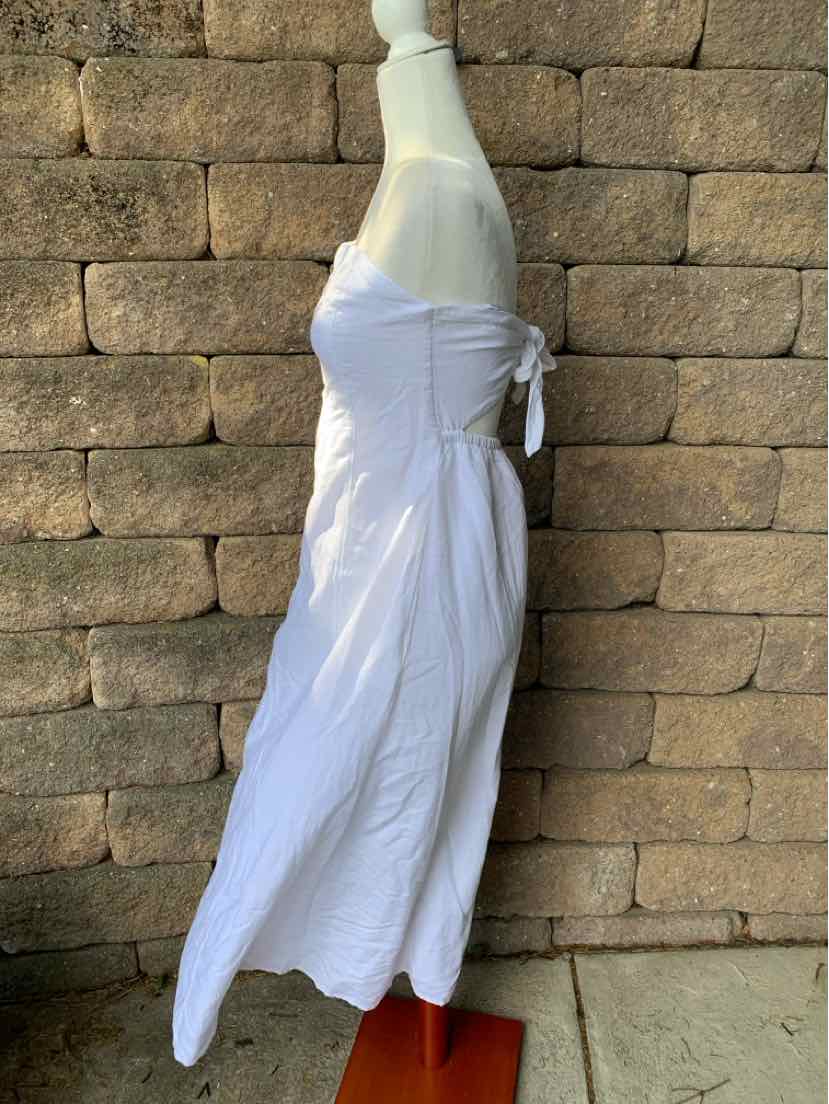 White sleeveless midi dress with fitted bodice and side tie detail, flowing skirt.