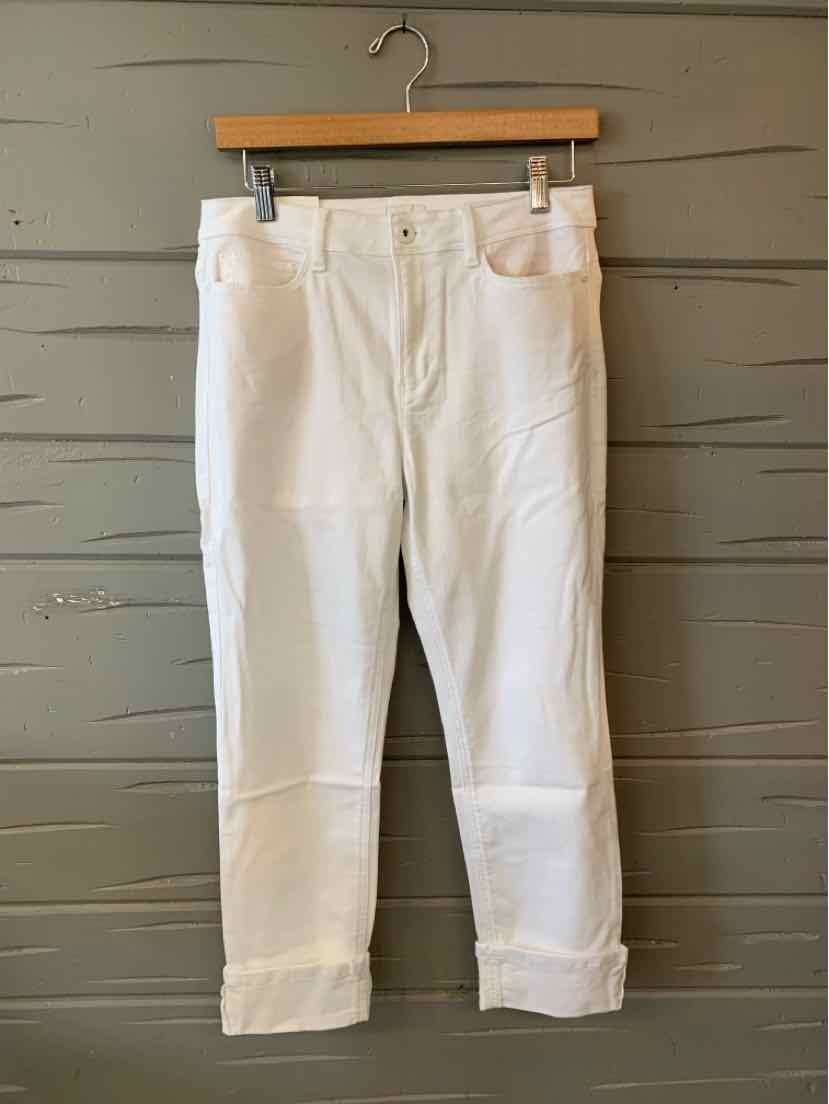 White denim jeans with rolled cuffs, high waist, and button fly closure.