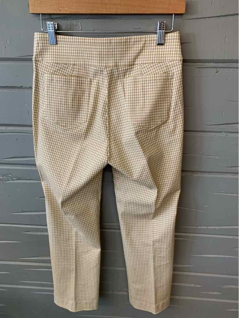 Beige plaid pants with a straight cut and back patch pockets hanging on hanger.