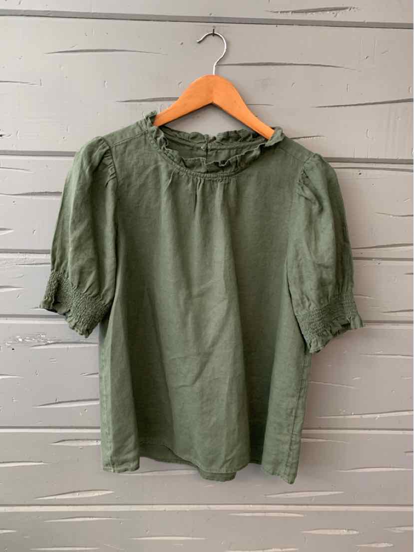 Olive green linen blouse with ruffled neckline and puffed three-quarter sleeves on wooden hanger.