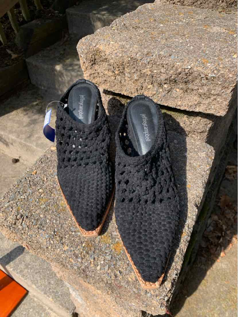 Black woven pointed-toe slip-on shoes with low heels, size 9.