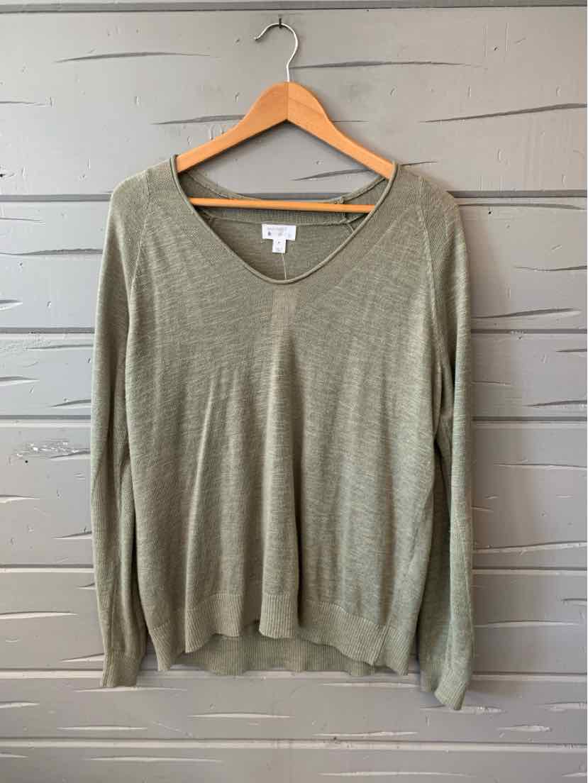 Light green V-neck long-sleeve sweater with a relaxed fit on wooden hanger.