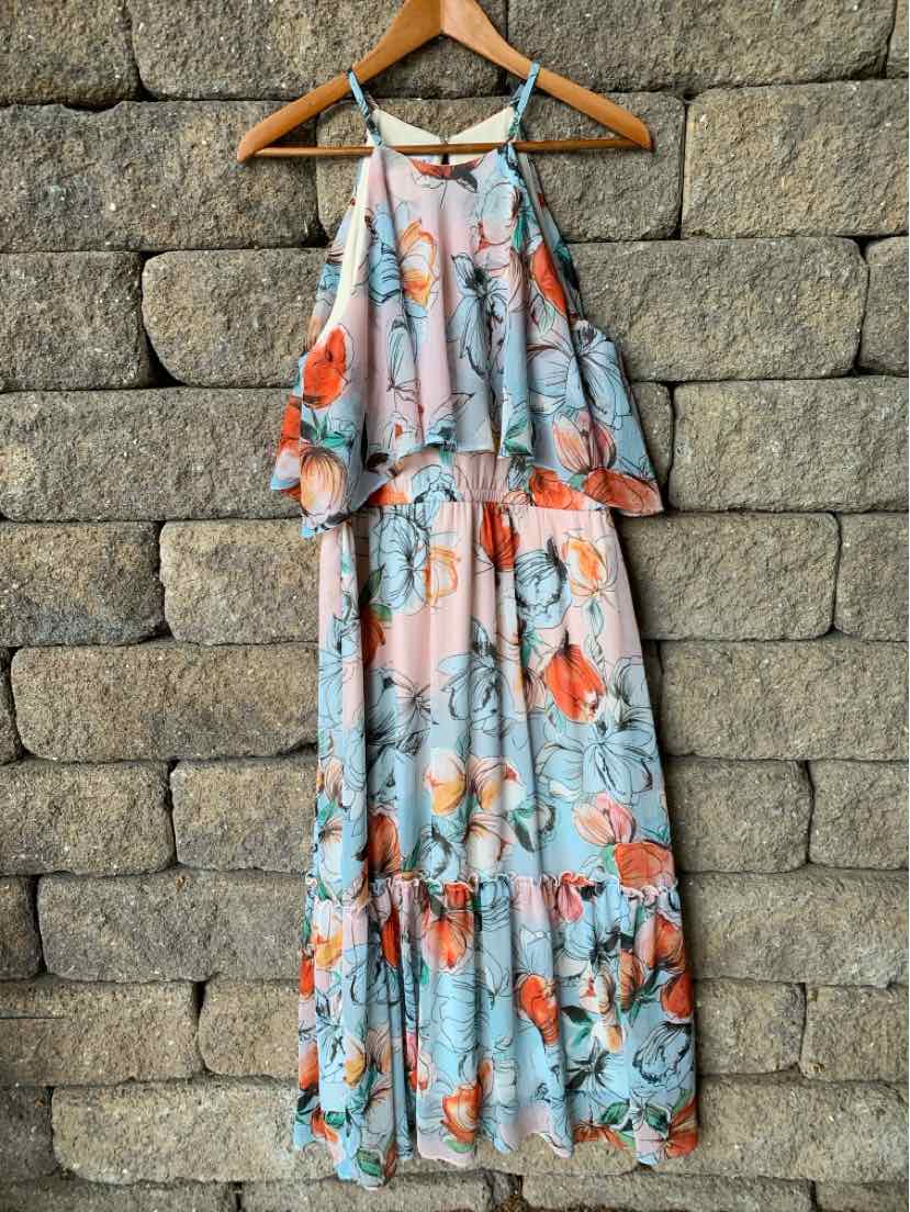 Light blue floral maxi dress with coral and orange flower print, sleeveless with thin straps and ruffled top detail.