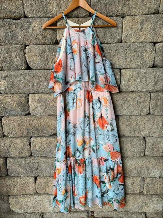 Light blue floral maxi dress with coral and orange flower print, sleeveless with thin straps and ruffled top detail.