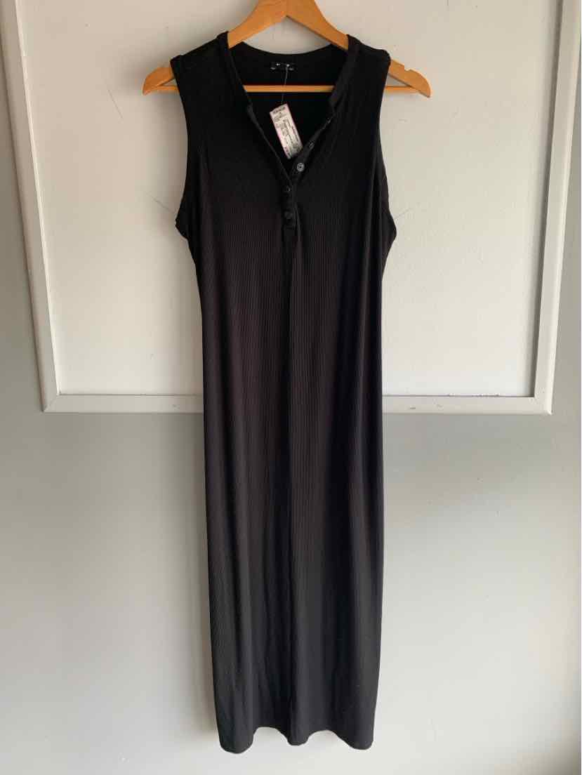 Long black sleeveless dress with scoop neckline and front buttons hanging on wooden hanger.