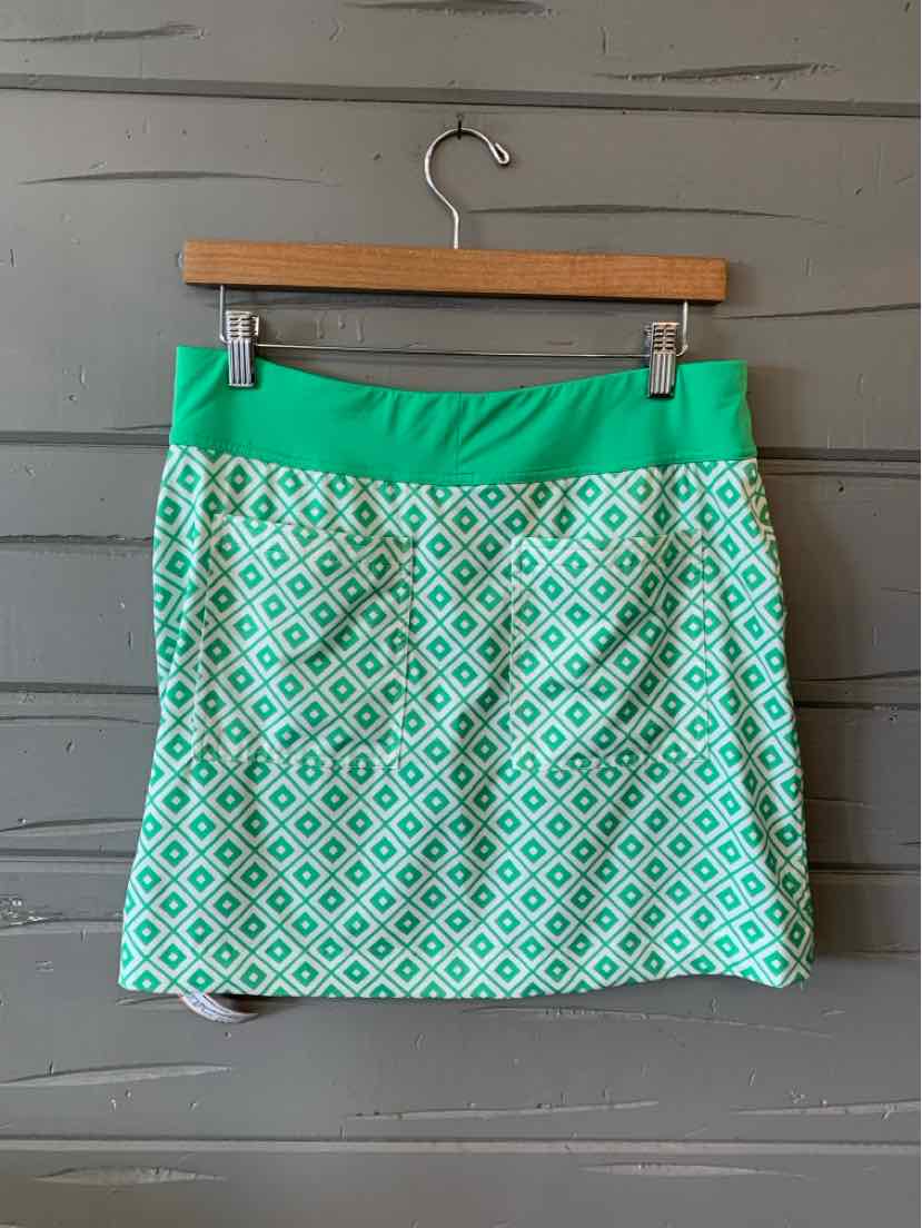 Green skirt with white diamond pattern, elastic waistband, above knee length, lightweight fabric.