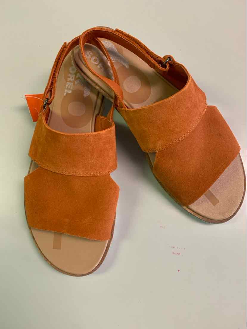 Women's orange suede open-toe sandals with wide front strap and adjustable ankle strap.