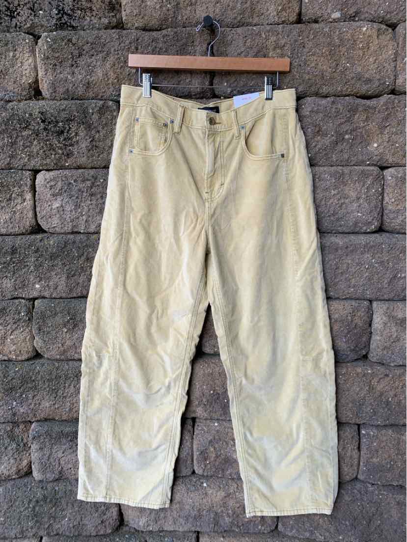 Tan straight-leg pants with a high waist, button and zipper closure, and five pockets.