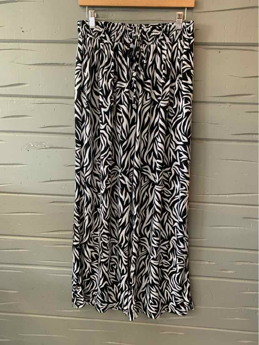 Black and white geometric patterned maxi skirt with a flowy, lightweight fabric and elastic waistband.