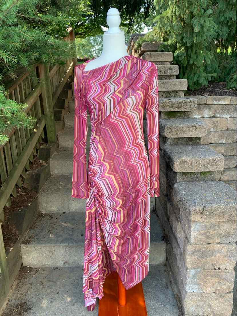 Asymmetrical long-sleeve midi dress in pink, red, and white wavy pattern with fitted silhouette and side slit.