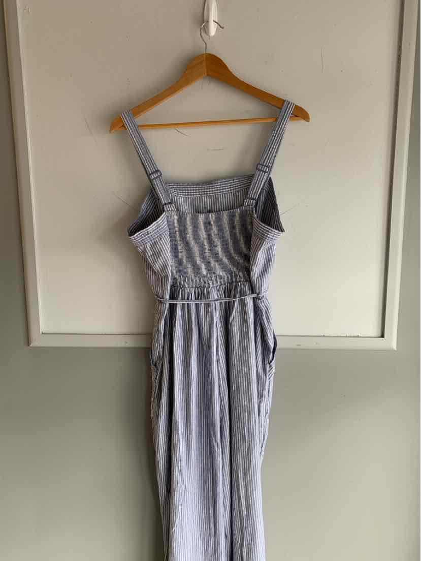 Blue and white striped sleeveless jumpsuit with adjustable straps and wide legs.
