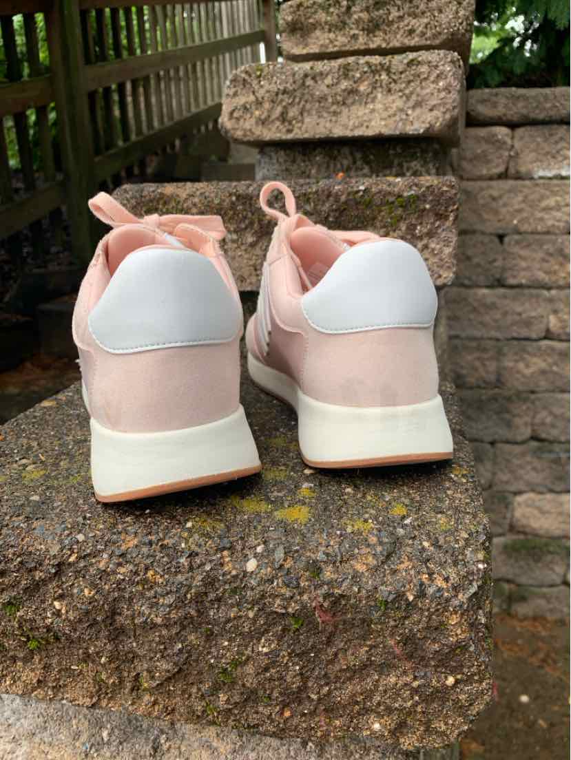 Pink DKNY sneakers size 8 with white heel accents and rubber soles viewed from the back.