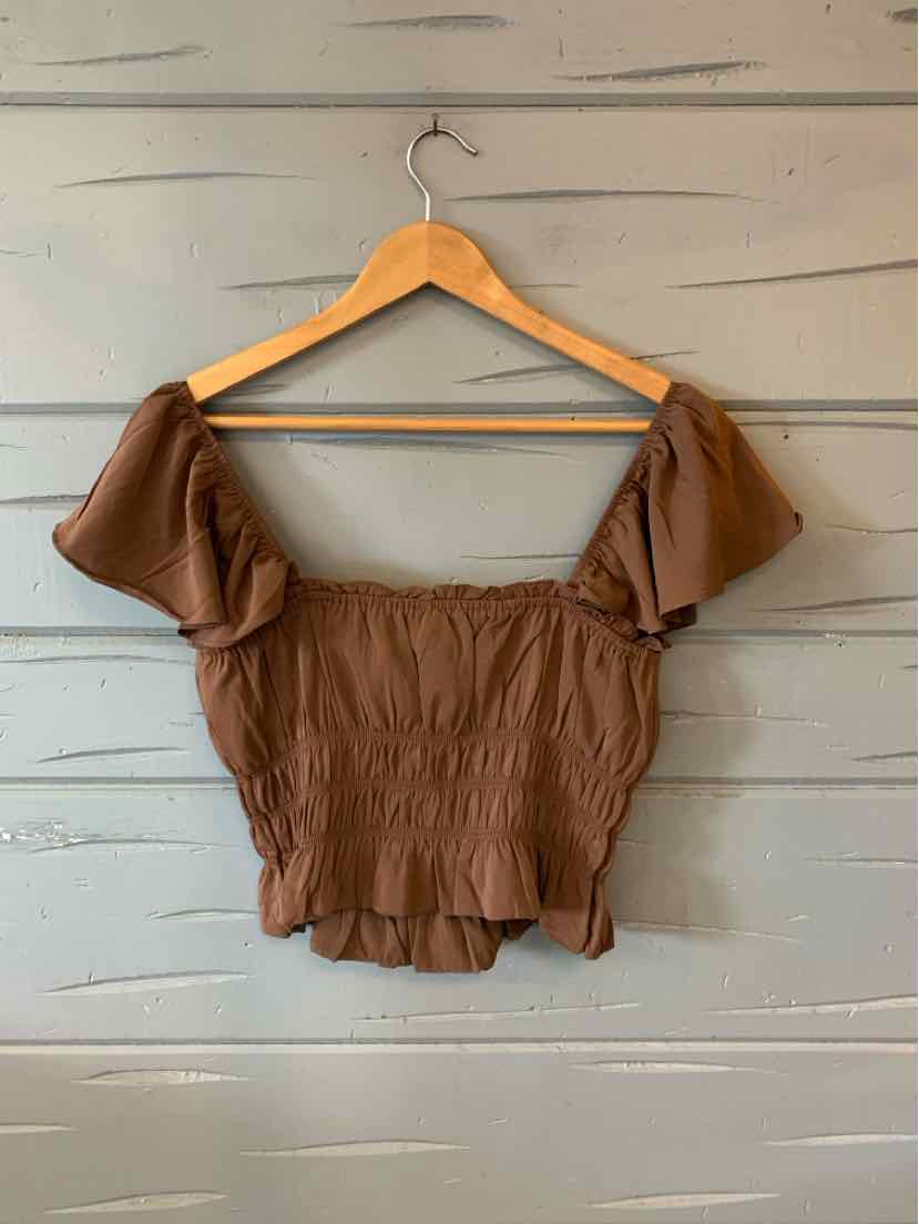 Brown off-shoulder cropped blouse with puffed sleeves and ruched fabric texture.