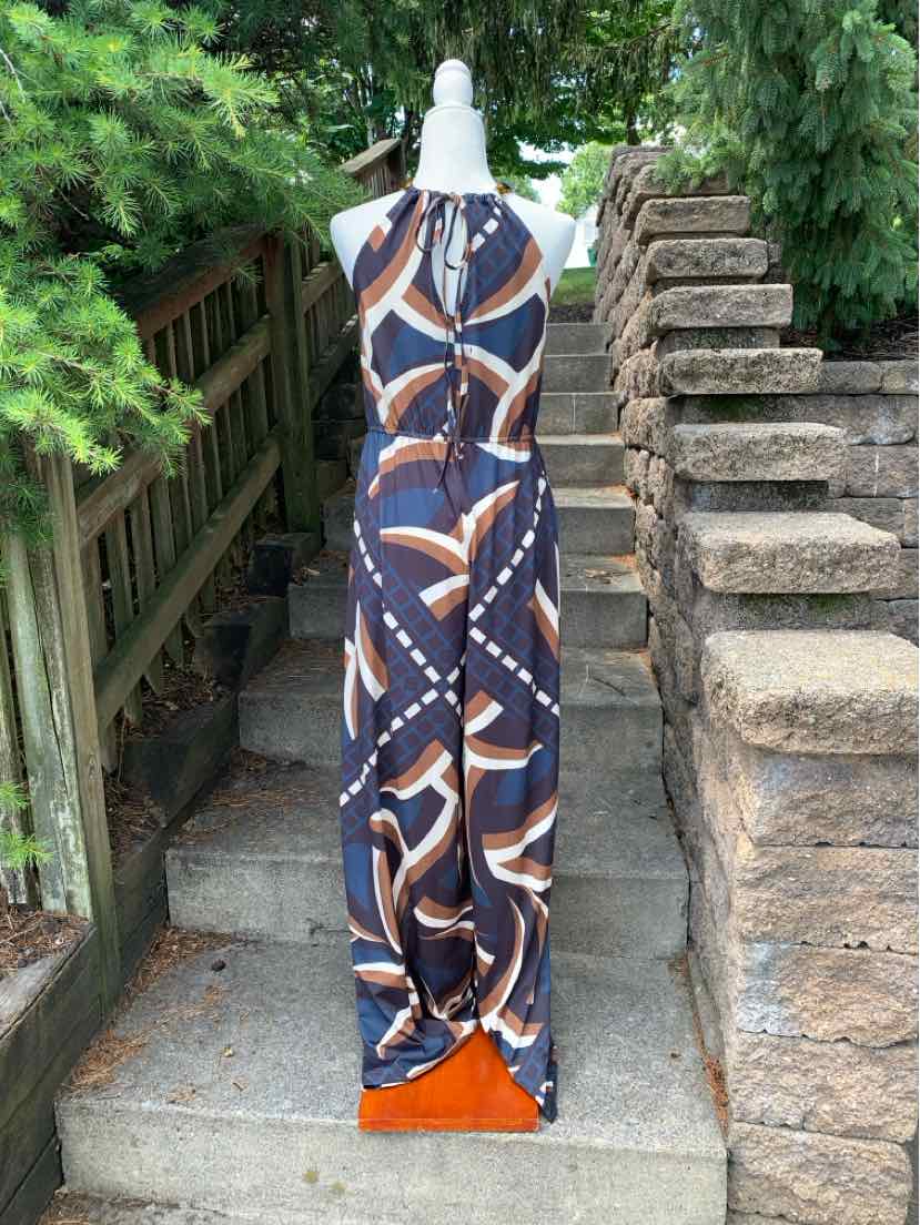 Sleeveless maxi dress with blue, white, and brown abstract geometric print and keyhole neckline.