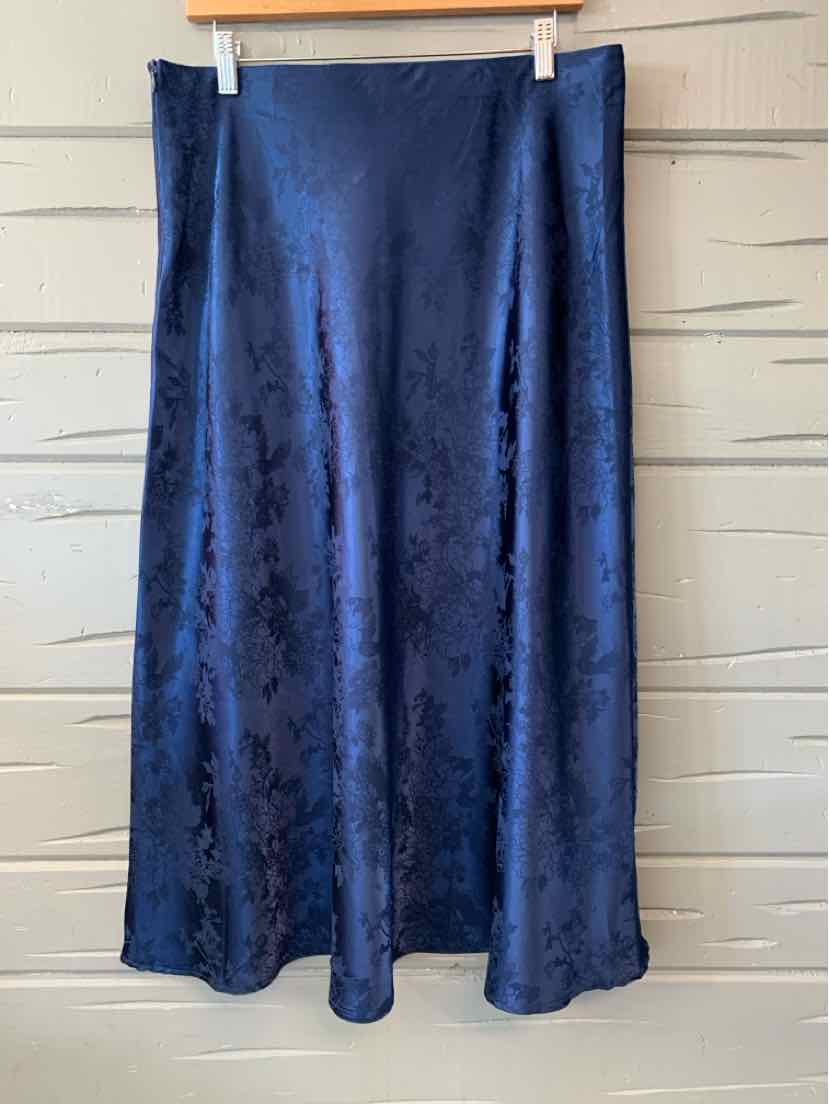 Navy blue floral satin midi skirt with slight A-line silhouette and smooth finish.