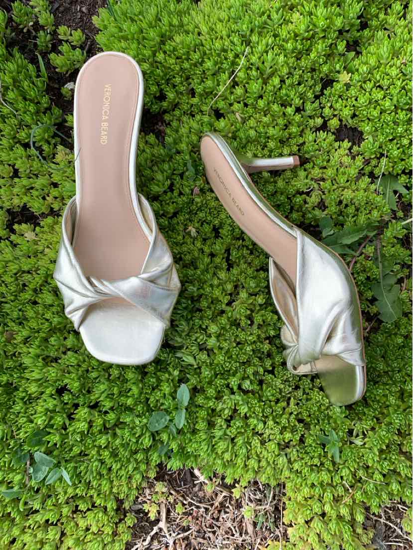 Metallic silver slip-on heels with square toes and ruched straps, size 8.5.