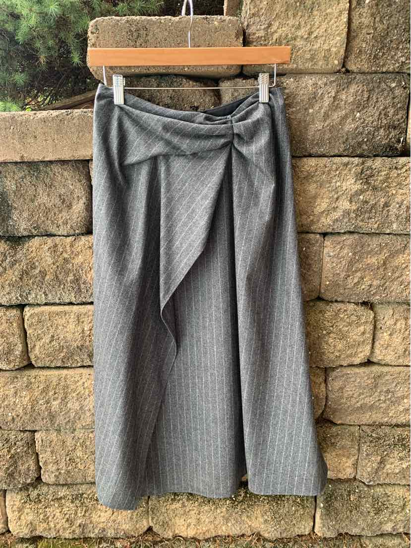 Gray pinstripe midi skirt with tie detail at waist, soft fabric, relaxed fit.