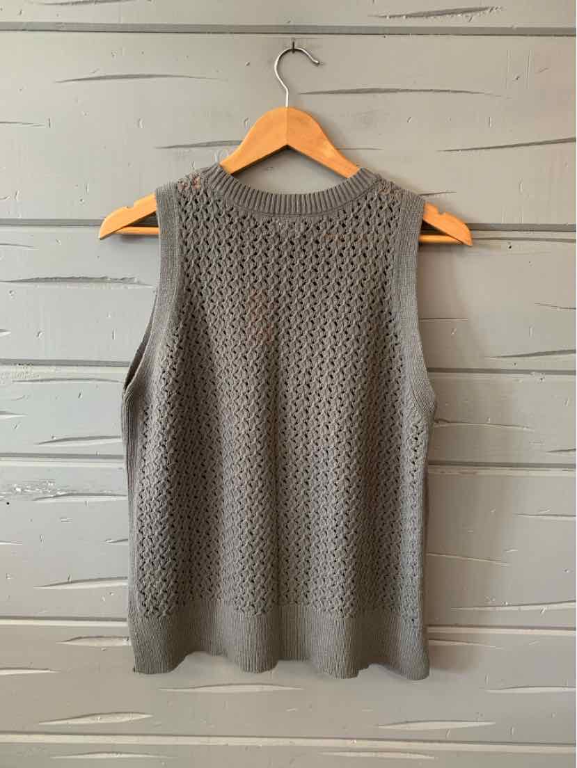 Gray sleeveless knit sweater with textured open weave pattern and ribbed hem.