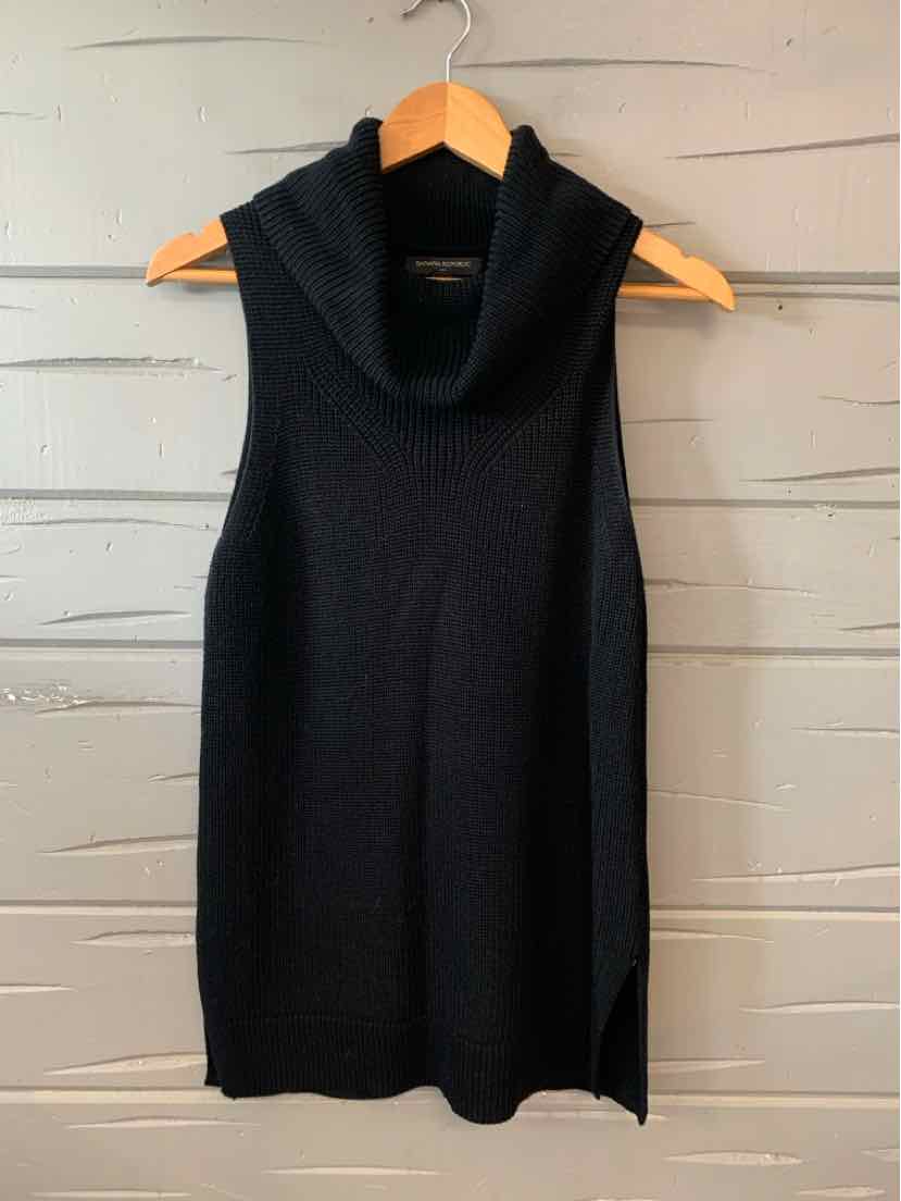 Black sleeveless knit top with cowl neck and straight hem hanging on wooden hanger.