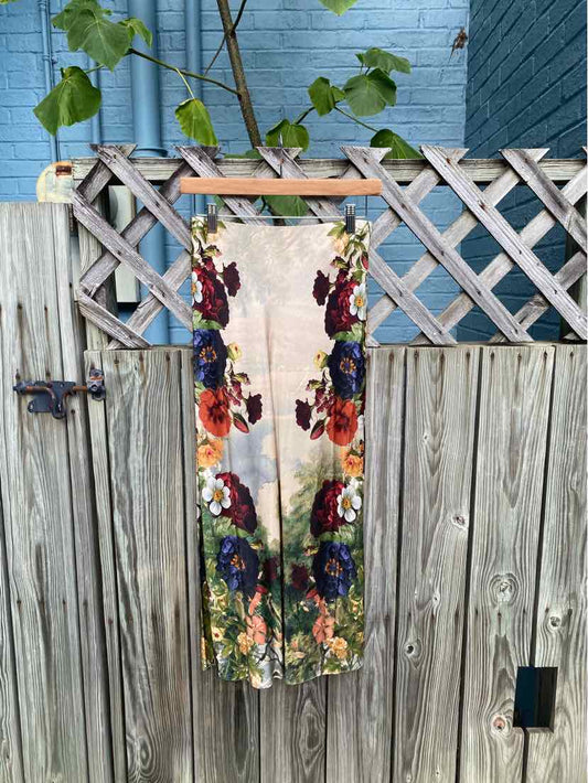 Long floral scarf with large purple, orange, and red flowers on a cream background, lightweight fabric.