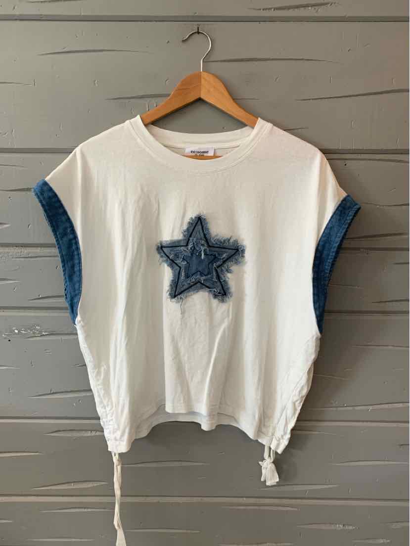 White short-sleeve top with wide blue denim cuffed sleeves and a large blue denim star patch on the front, featuring.