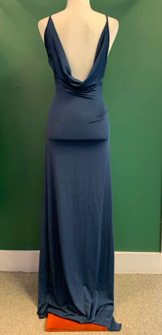 Navy blue sleeveless maxi dress with deep draped back and slim fit silhouette.