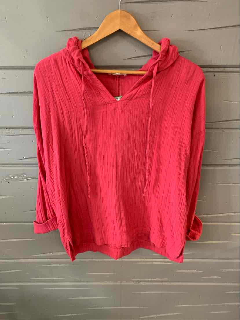 Red lightweight hooded long-sleeve top with V-neck and relaxed fit on wooden hanger.