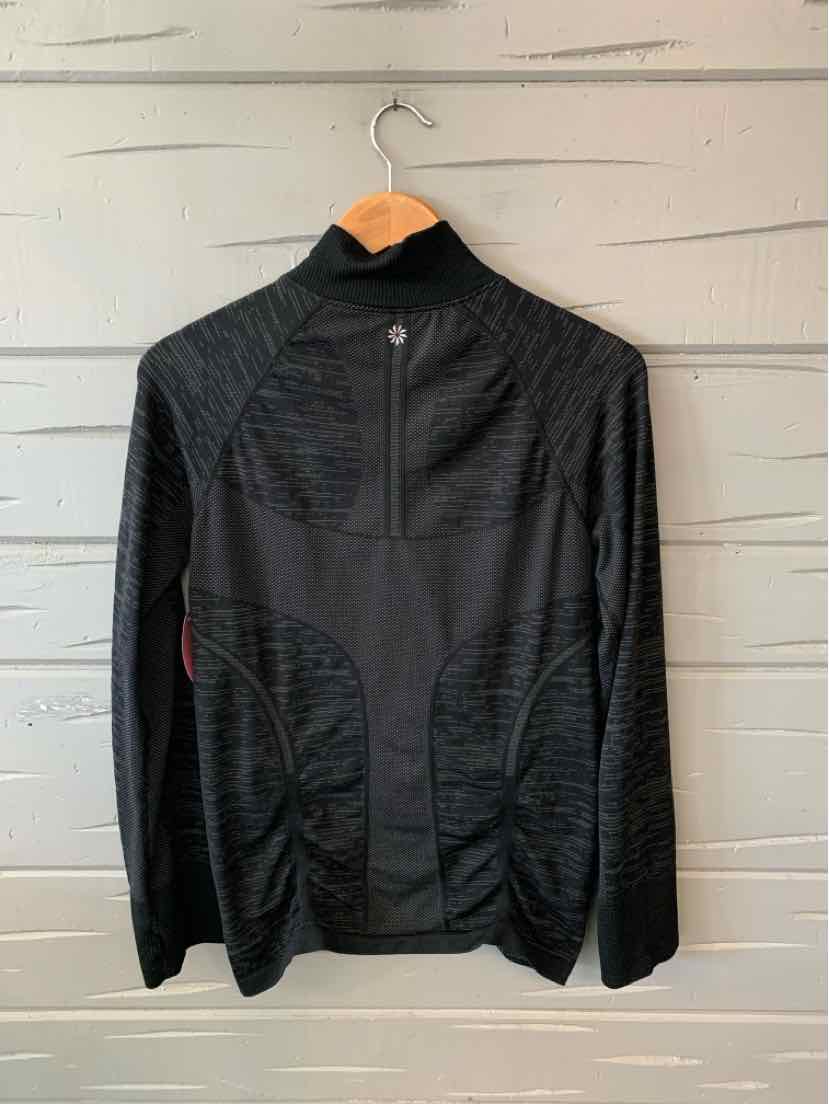 Black zip-up athletic jacket with high collar and textured panel details, size large.