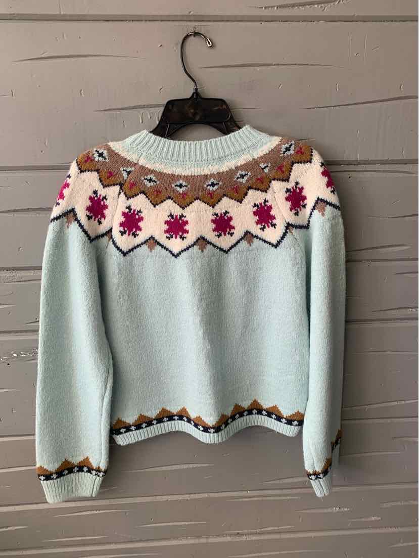 Light blue sweater with pink and brown Nordic pattern on yoke, ribbed cuffs and hem.