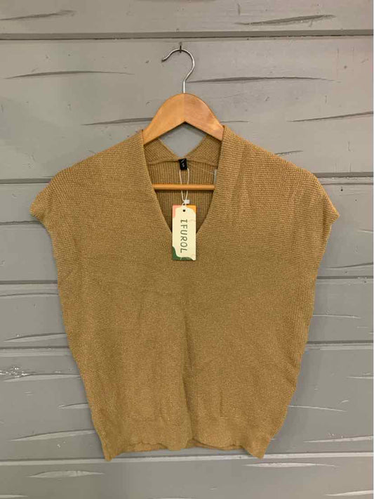 Beige short-sleeve knit sweater with v-neck and ribbed hem on wooden hanger.