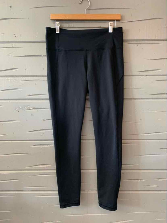 Black high-waisted Under Armour leggings with a slim fit and smooth fabric finish.