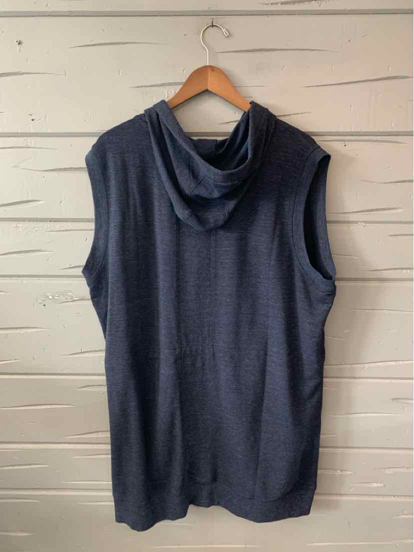Sleeveless dark blue hooded athletic top with a relaxed fit hanging on wooden hanger.