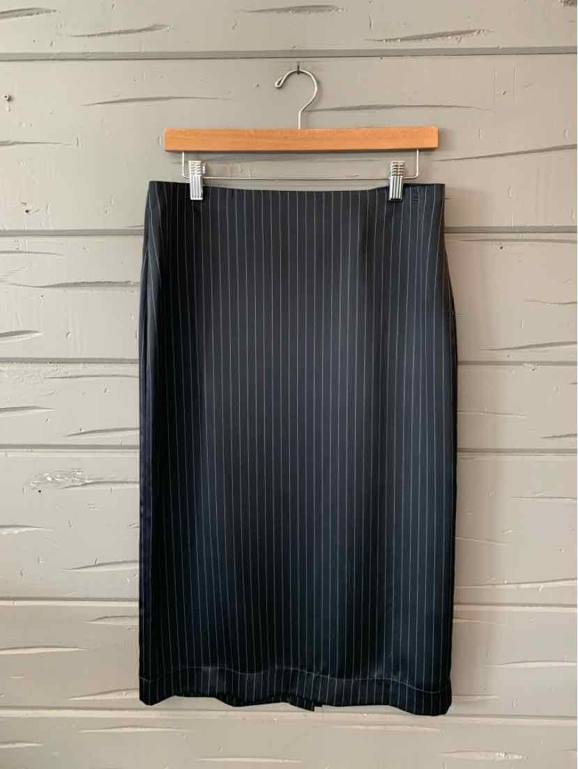 Black knee-length pencil skirt with vertical ribbed texture and fitted waistband.