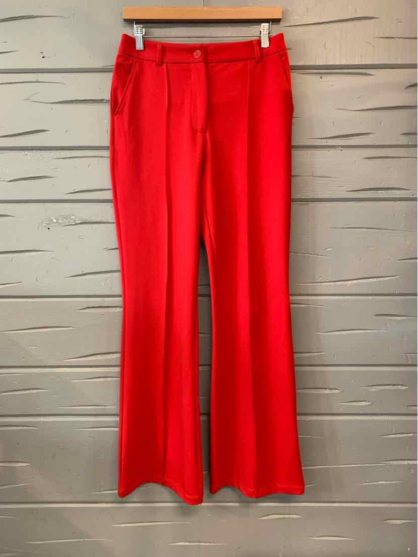Bright red women’s trousers with a straight-leg cut, belt loops, and a front closure.