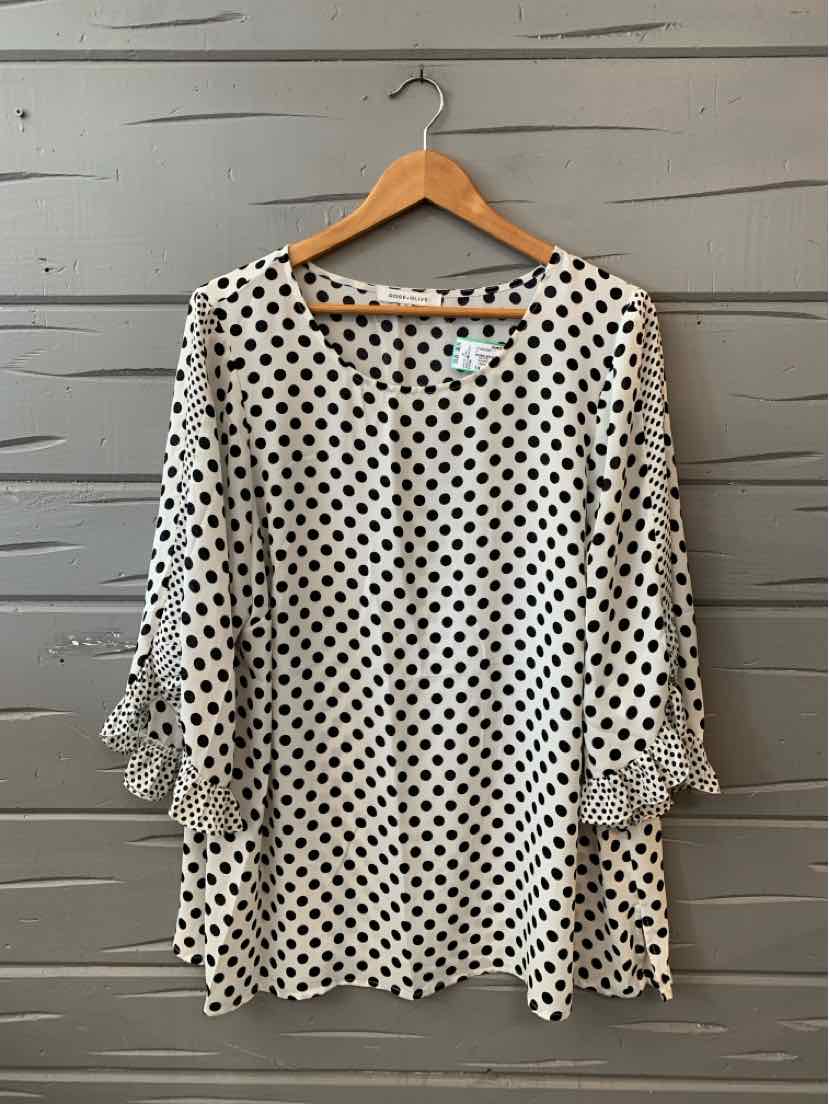 White blouse with black polka dots, 3/4 sleeves, and tie details at cuffs, size 1X.