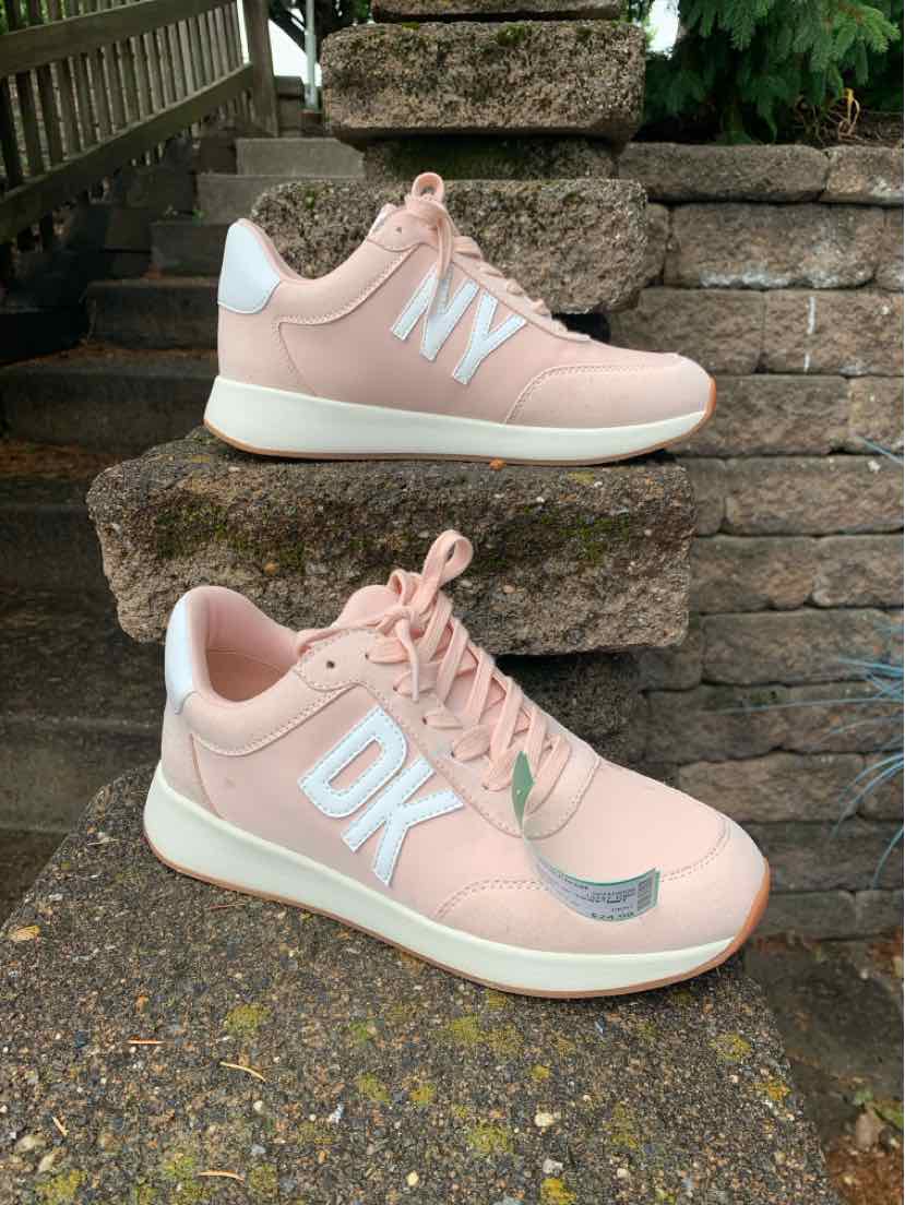 Pink DKNY women's sneaker size 8 with white logo and white heel detail, textured sole.