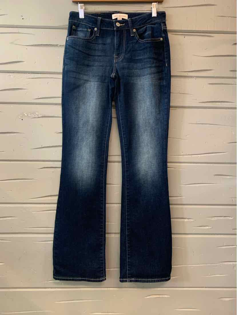 Dark blue Lucky Brand denim jeans with a faded wash, mid rise, and straight legs.