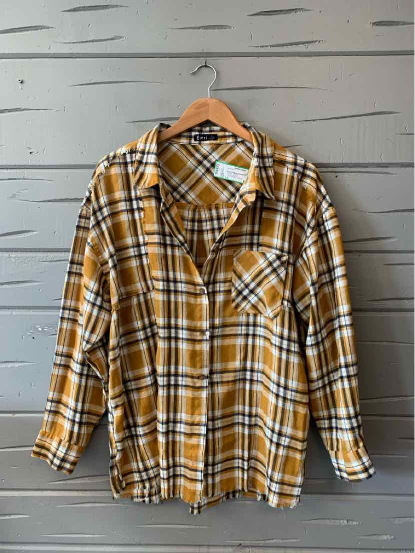 Yellow and black plaid flannel shirt with long sleeves and chest pocket on wooden hanger.