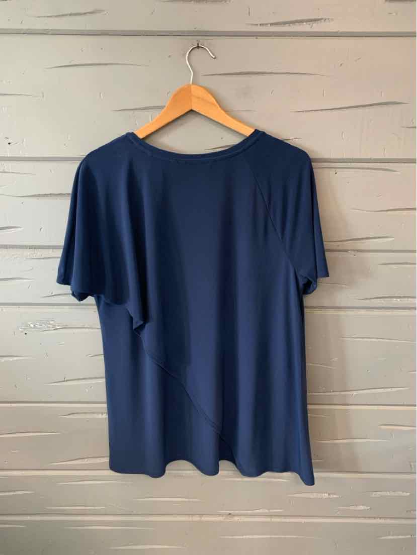 Navy blue short-sleeve loose-fit T-shirt with round neckline hanging on wooden hanger.